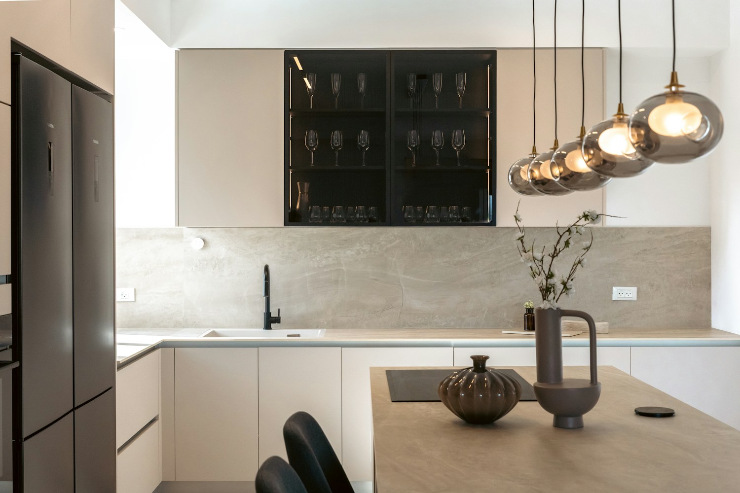 Modern kitchen with lighting and fitted electrical appliances